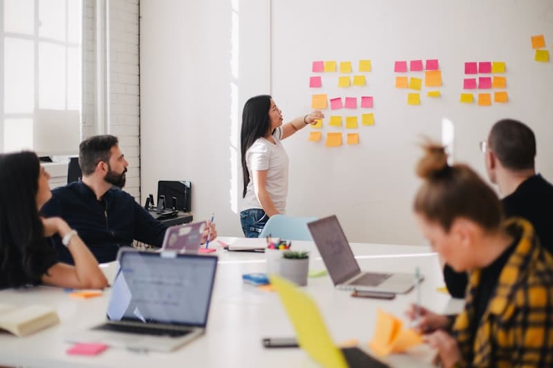 Team collaborating with sticky notes